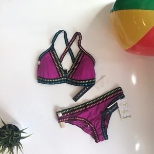 Fuchsia bikini bottoms with colorful stitching